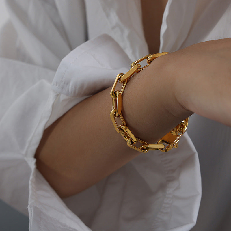 Stylish 18K gold plated Cuban chain bracelet on a white background.