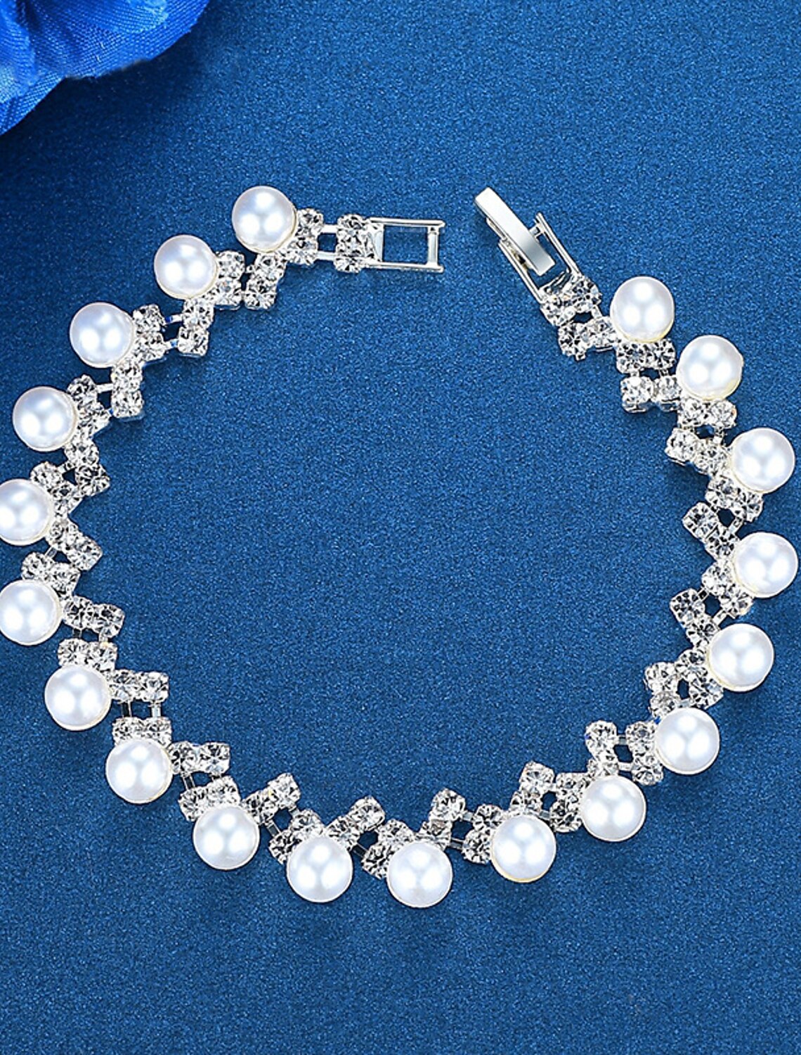 Matching imitation pearl bracelet and earrings.