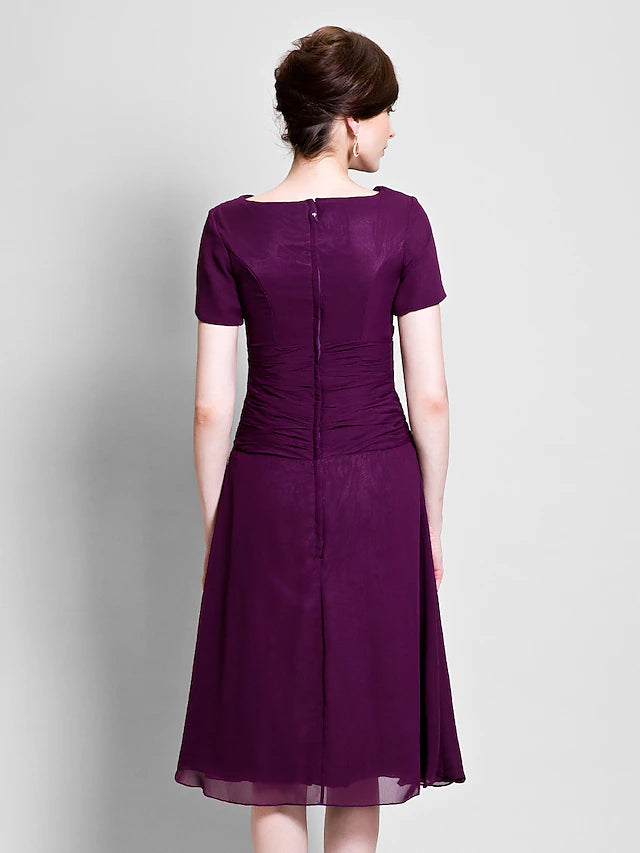 Close-up of cowl neck and short sleeve detail on the Mother of the Bride dress.