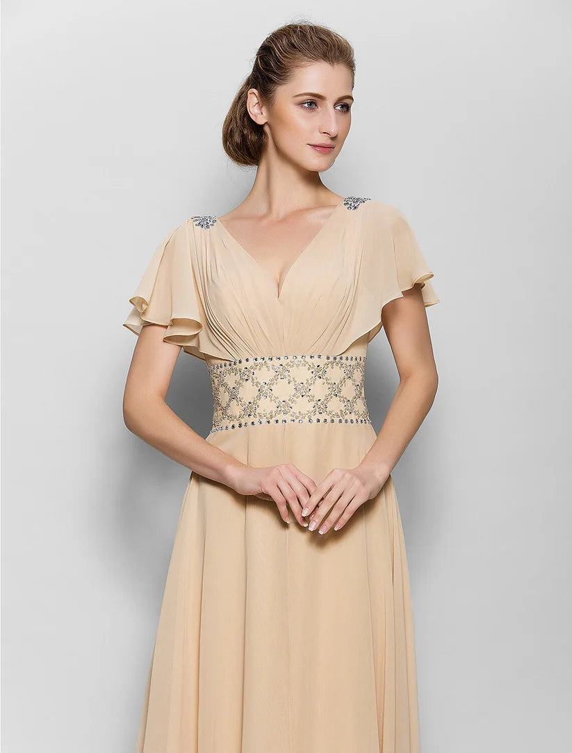 A-line chiffon mother of the bride dress with V-neck and short sleeves, featuring criss-cross beading on the back.