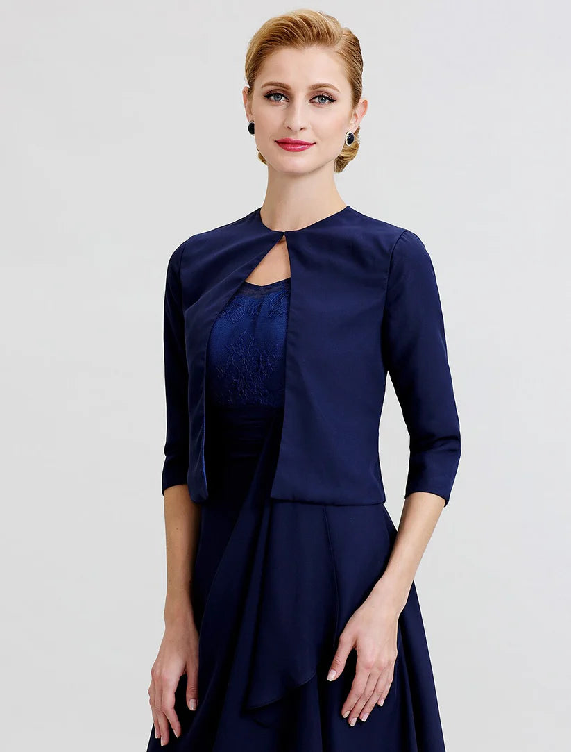 Woman posing in the knee-length chiffon and lace dress.
