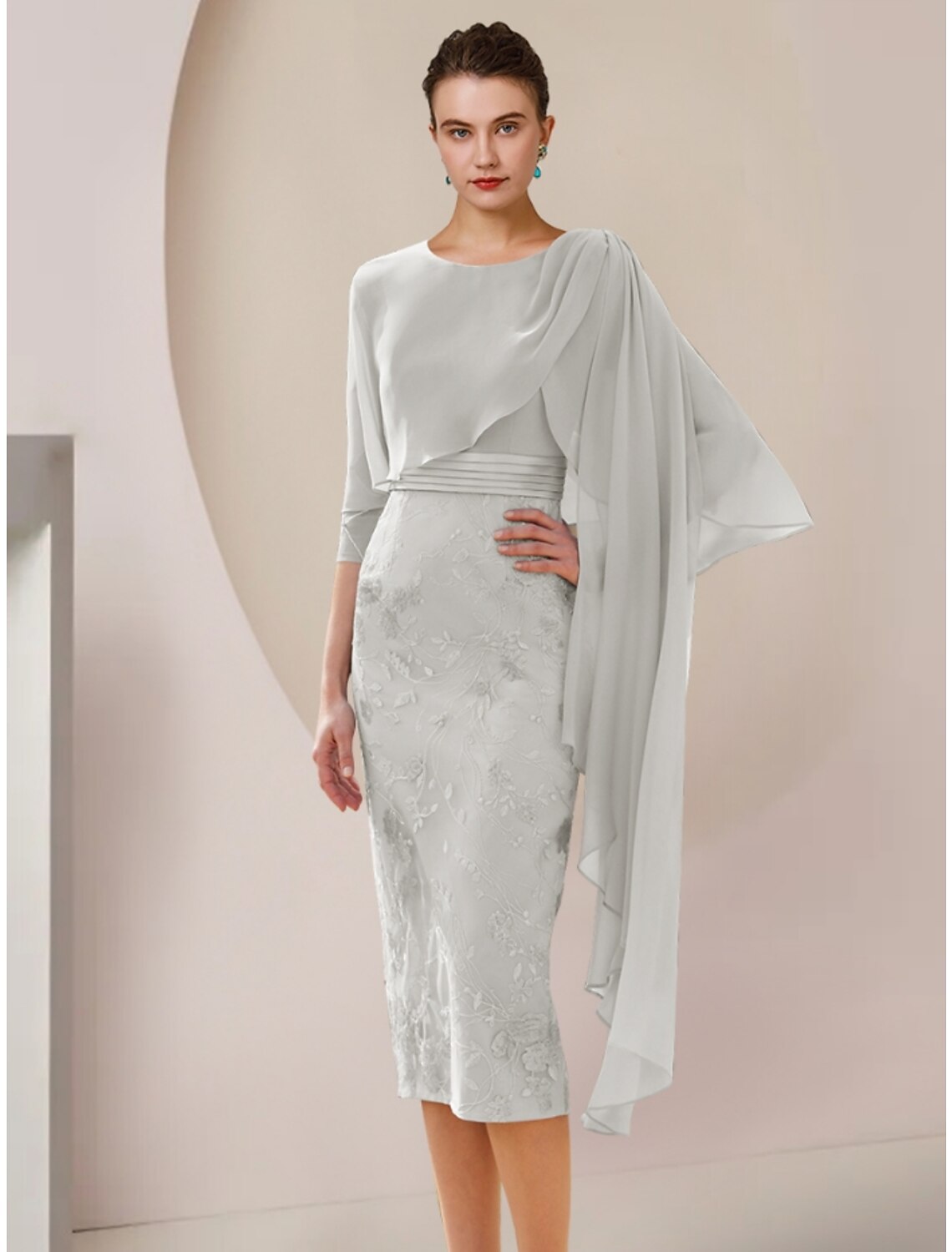 Elegant A-Line Mother of the Bride dress with jewel neck and half sleeves.