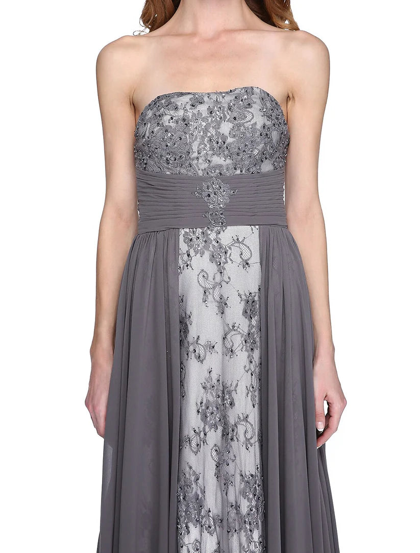 Woman posing gracefully in the strapless Mother of the Bride dress with wrap.