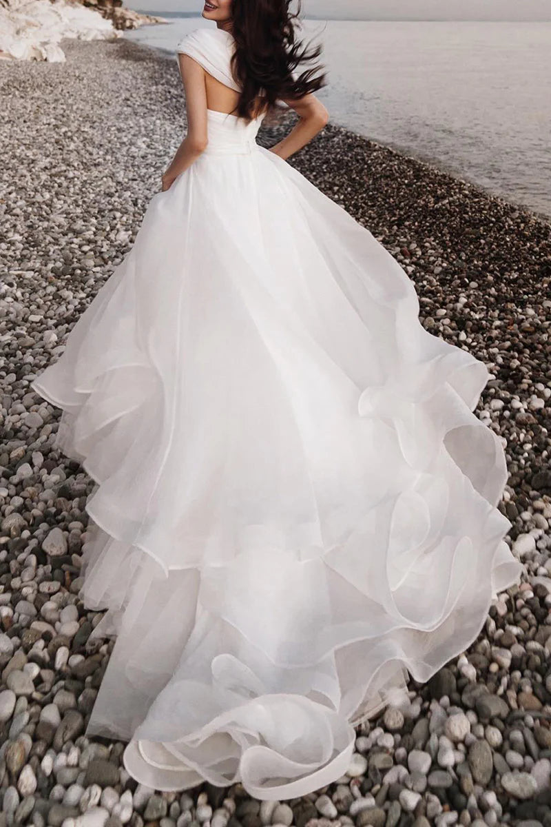 Back view of the A-line one-shoulder organza wedding dress.
