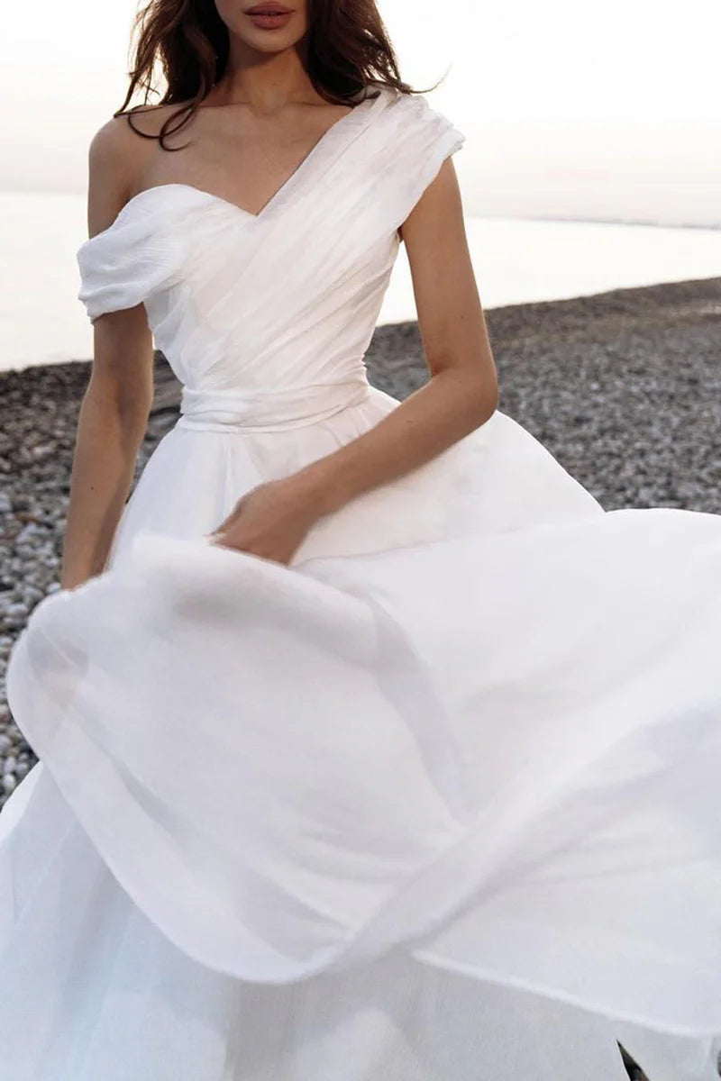 Side profile of the A-line one-shoulder organza wedding dress, showcasing the silhouette.