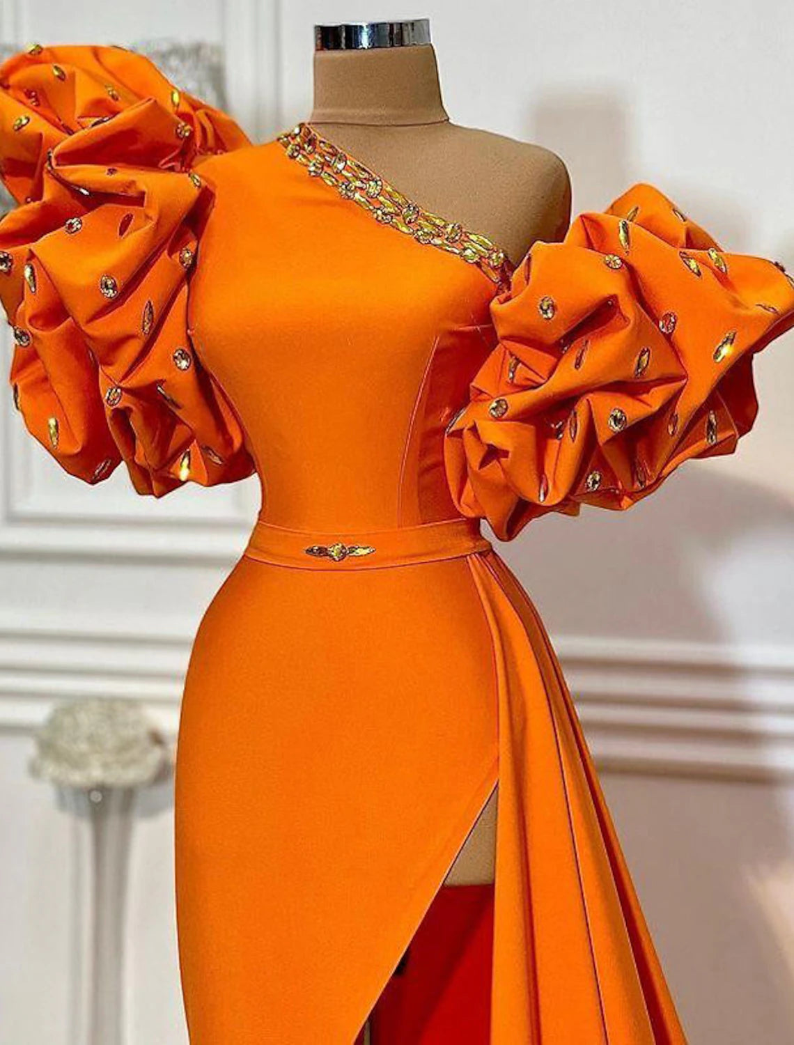 Side profile of the A-line one-shoulder satin evening gown, showcasing the floral pattern and elegant court train.