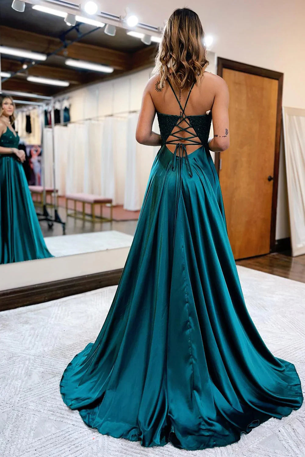 Full length view of an A-Line satin prom dress, highlighting the fabric and design.