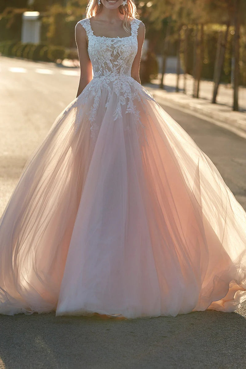 A-line scoop neck wedding dress with lace appliques and sweep train, front view.