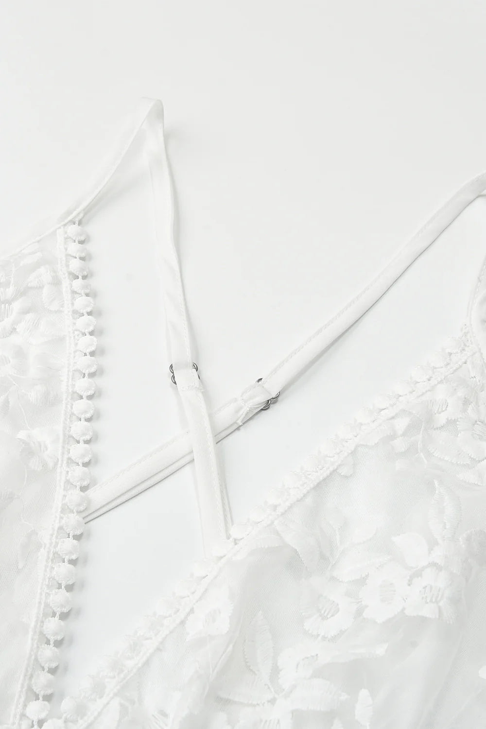 Full length view of a model in a white short wedding dress.