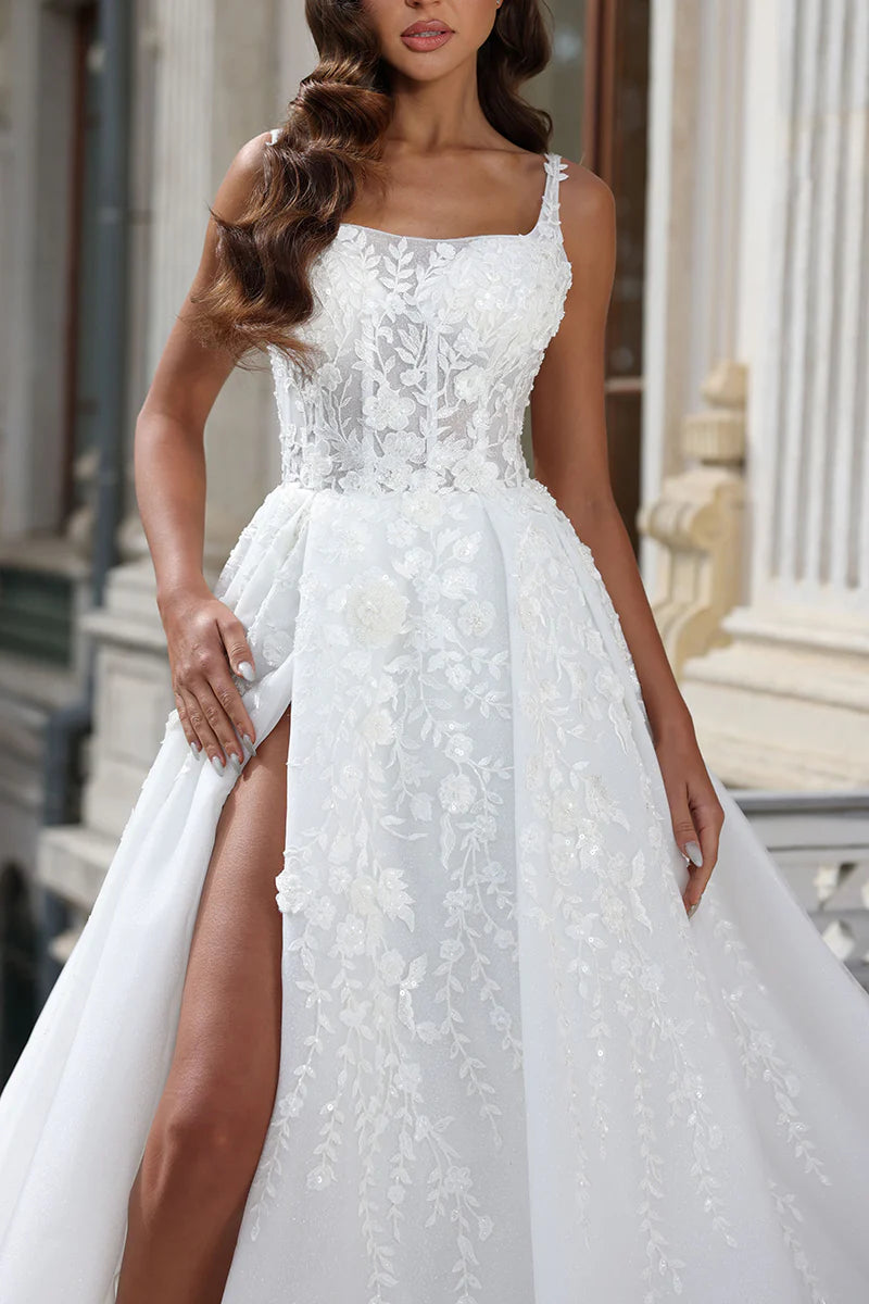 Back view of an A-line wedding dress showing the court train and lace details.