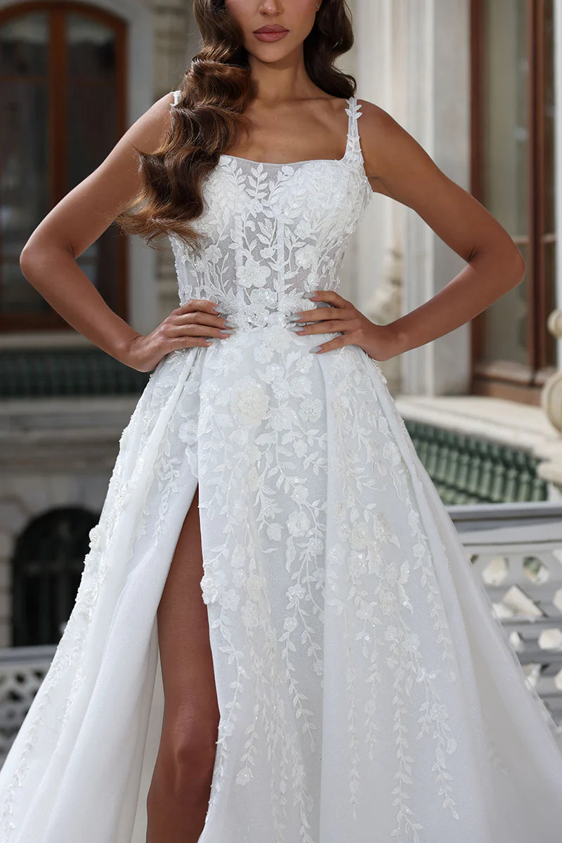 Side view of a sleeveless A-line wedding dress with a square neckline and high split.