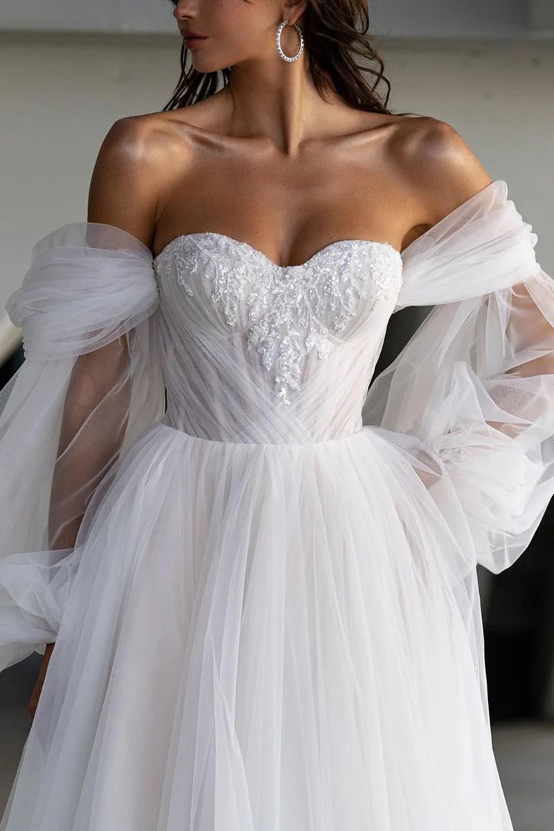 Side view of an A-line sweetheart applique casual wedding dress.