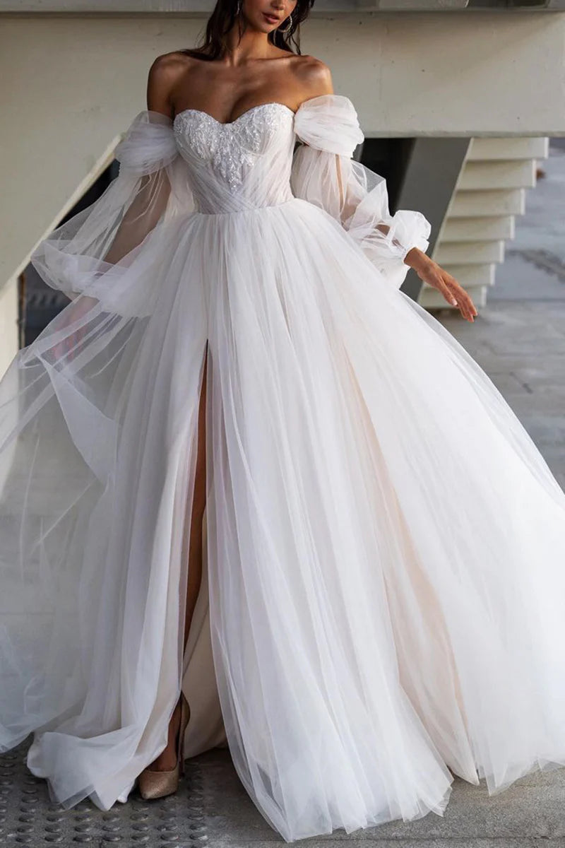 Back view of an A-line sweetheart applique casual wedding dress.