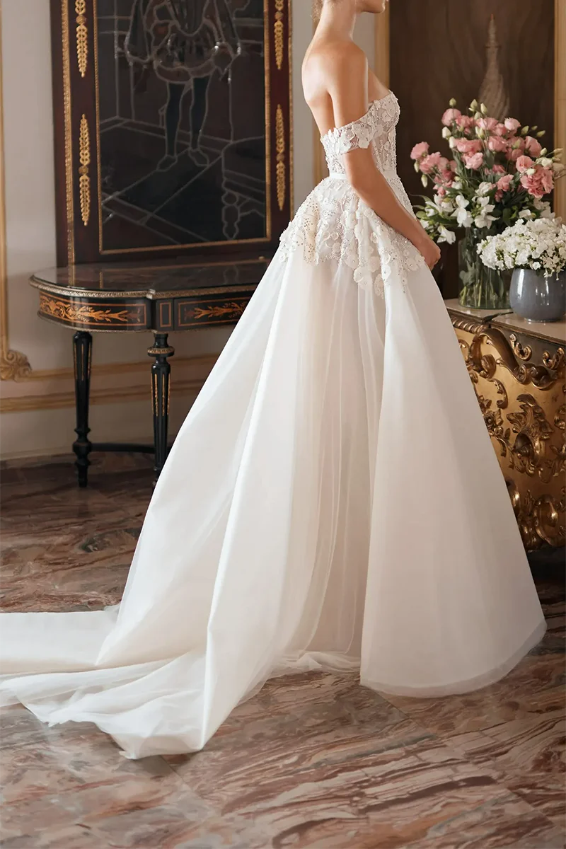 Sweetheart neckline and delicate appliques on a bridal gown.
