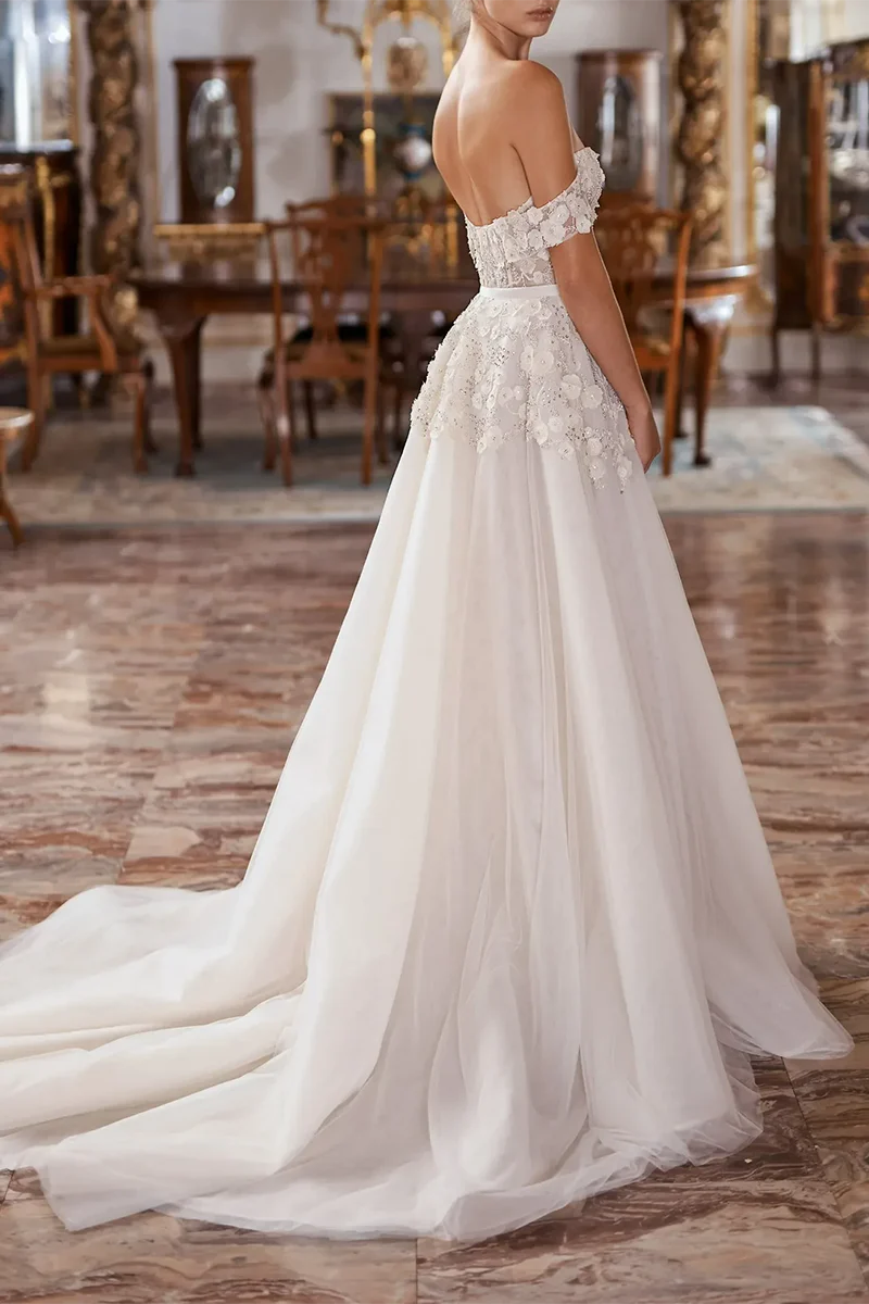 Back view of A-line wedding dress with court train and appliques.