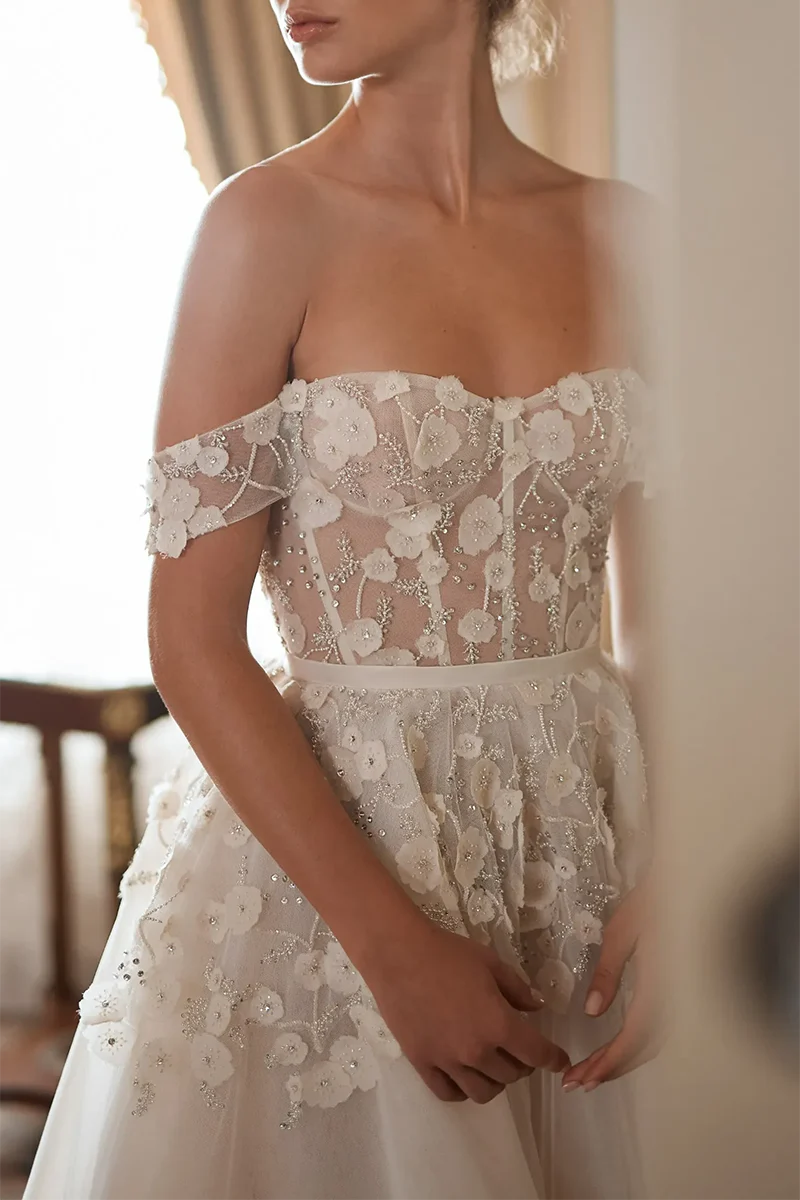 Full view of the A-line wedding dress with appliques and court train.