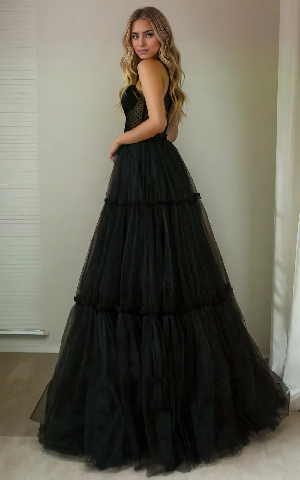 Back view of an A-line sweetheart tulle wedding dress, showing the corset closure.