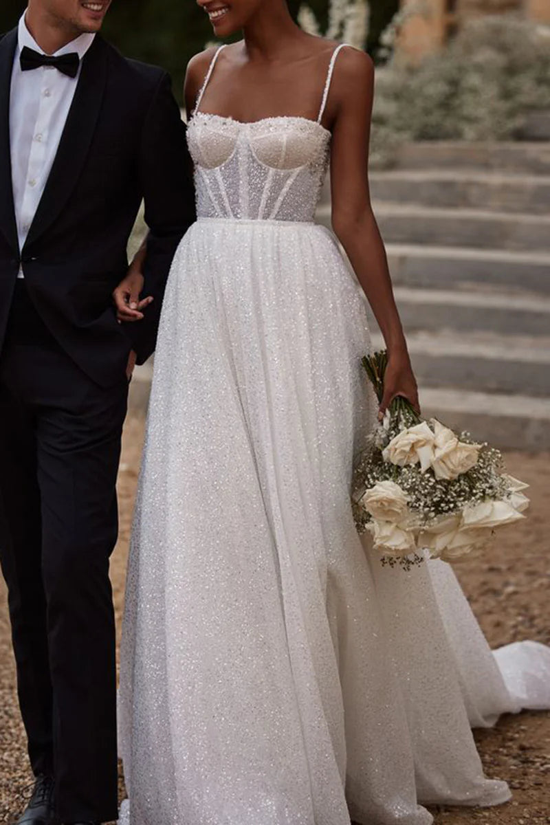 Elegant A-line sweetheart wedding dress with beadwork and sweep train, front view.