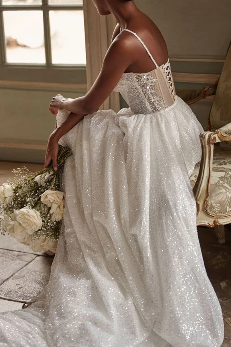 Close-up of the sweetheart neckline and intricate beadwork on the wedding dress bodice.