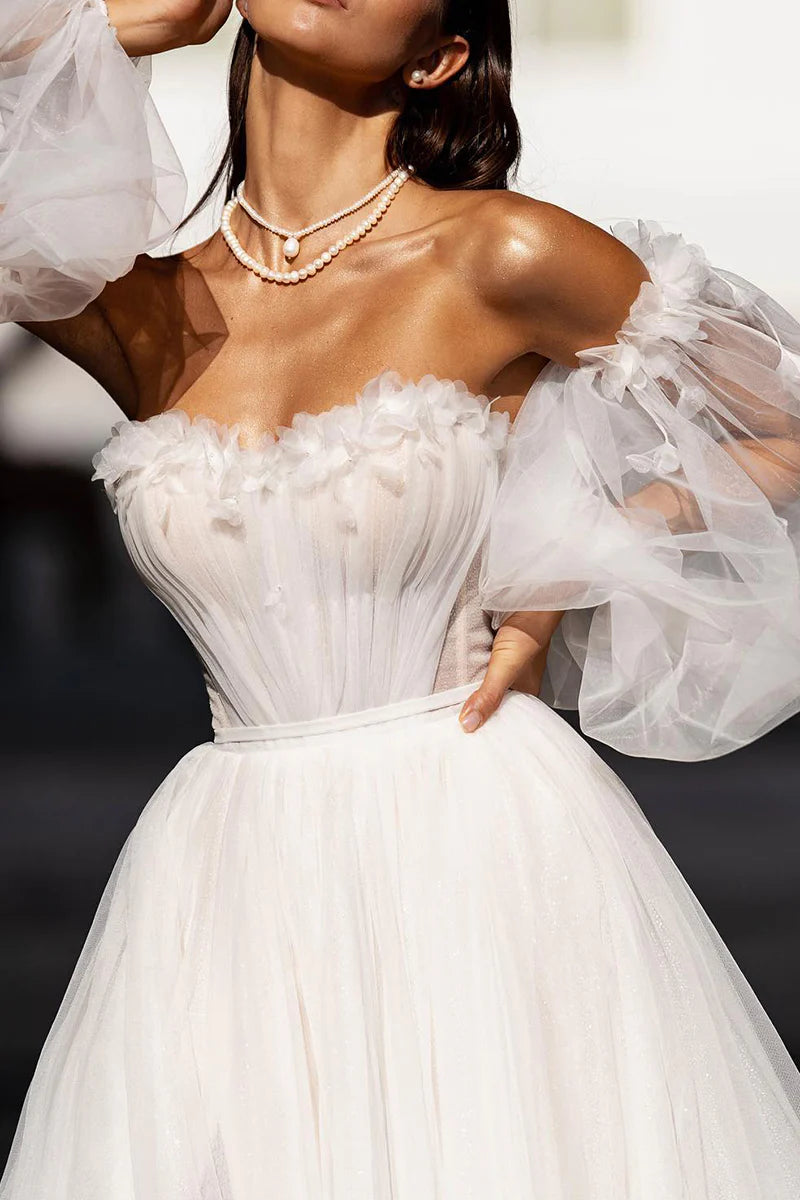 Front view of the A-line wedding dress, highlighting the sweetheart bodice and applique details.