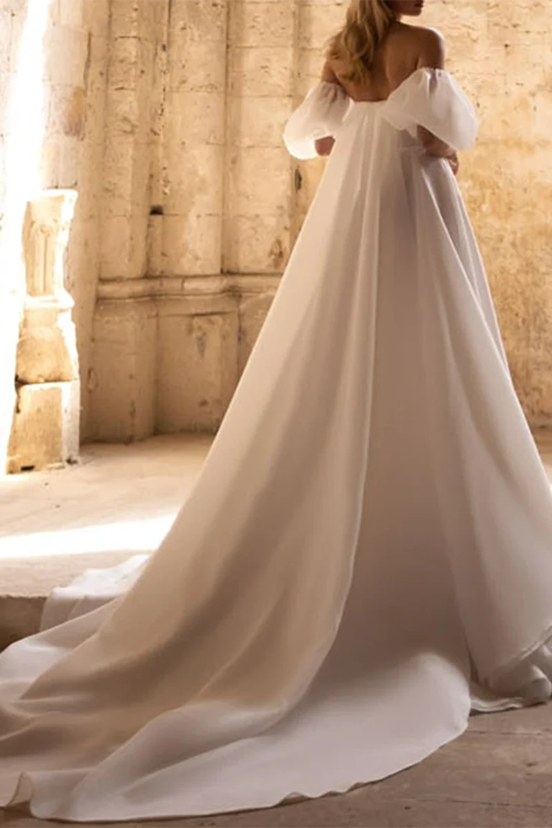 Back view of an A-line wedding dress, showcasing the flowing court train.