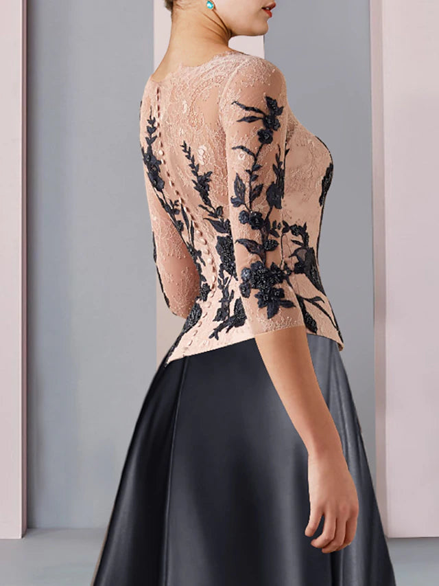 Back view of A-line V-neck tea length dress showing color block detail.