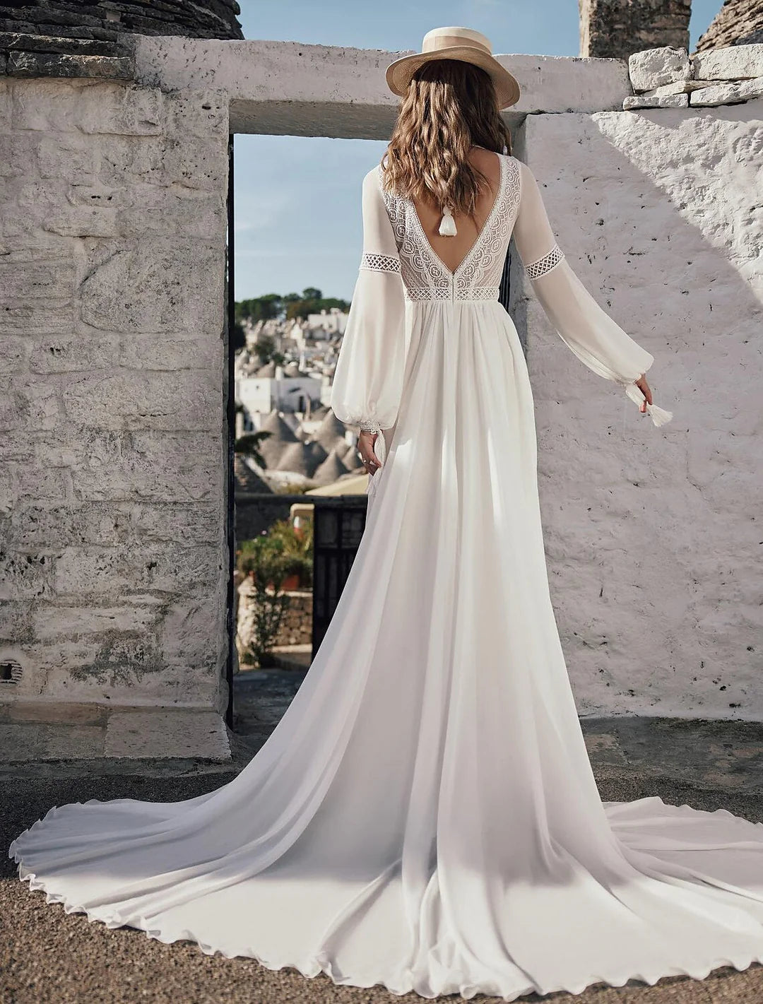 Back view of an A-line V-neck lace wedding dress, showcasing lace details.
