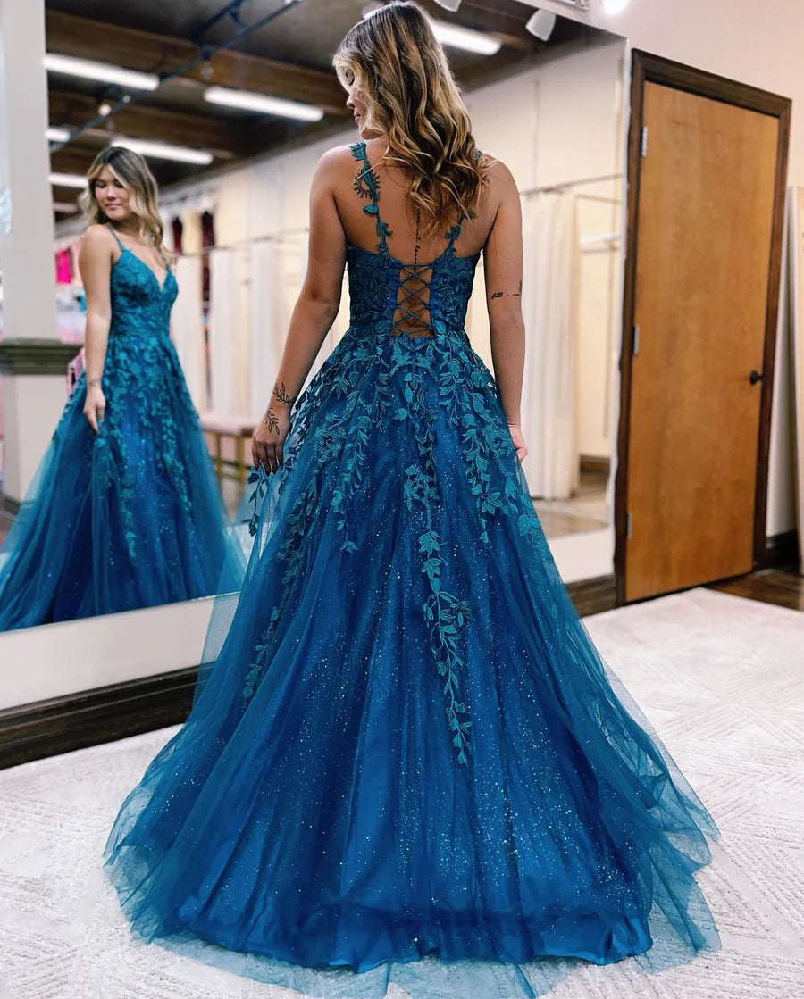 Woman wearing an A-Line V-Neck Tulle Applique Long Prom Dress.