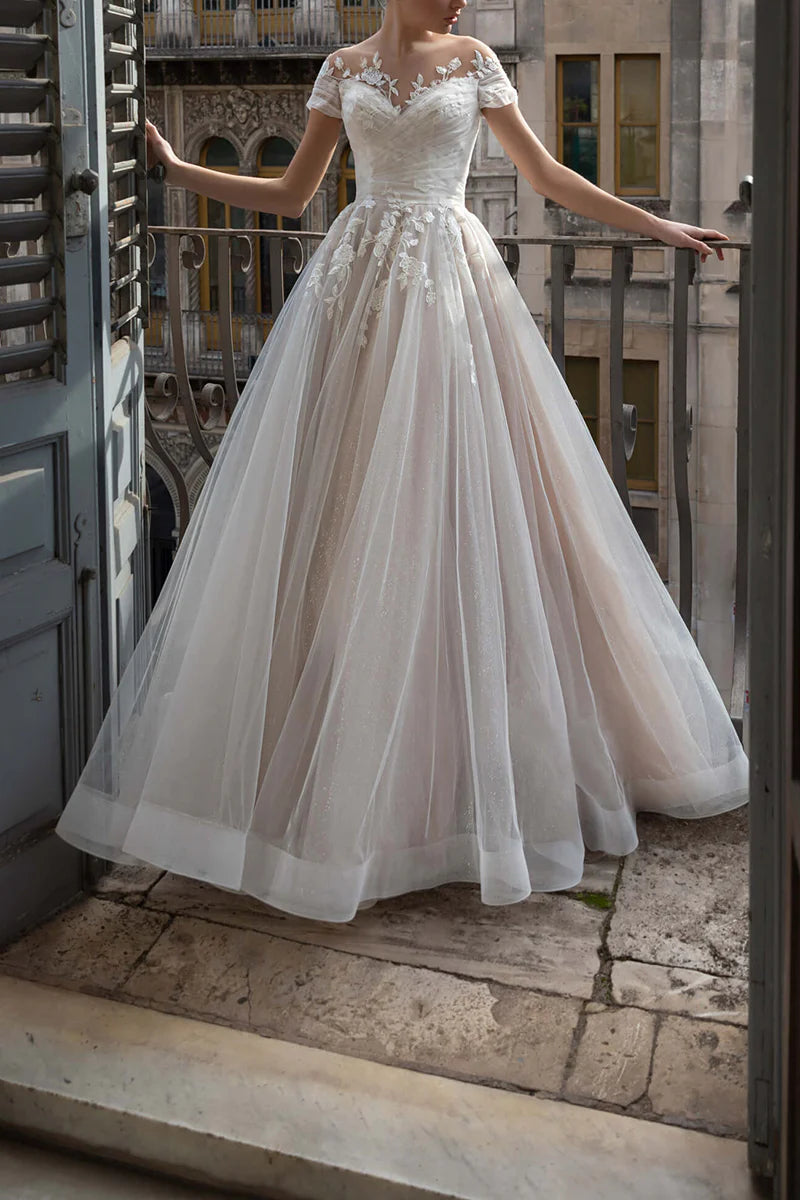 Elegant A-line V-neck wedding dress with short sleeves and delicate lace appliques.