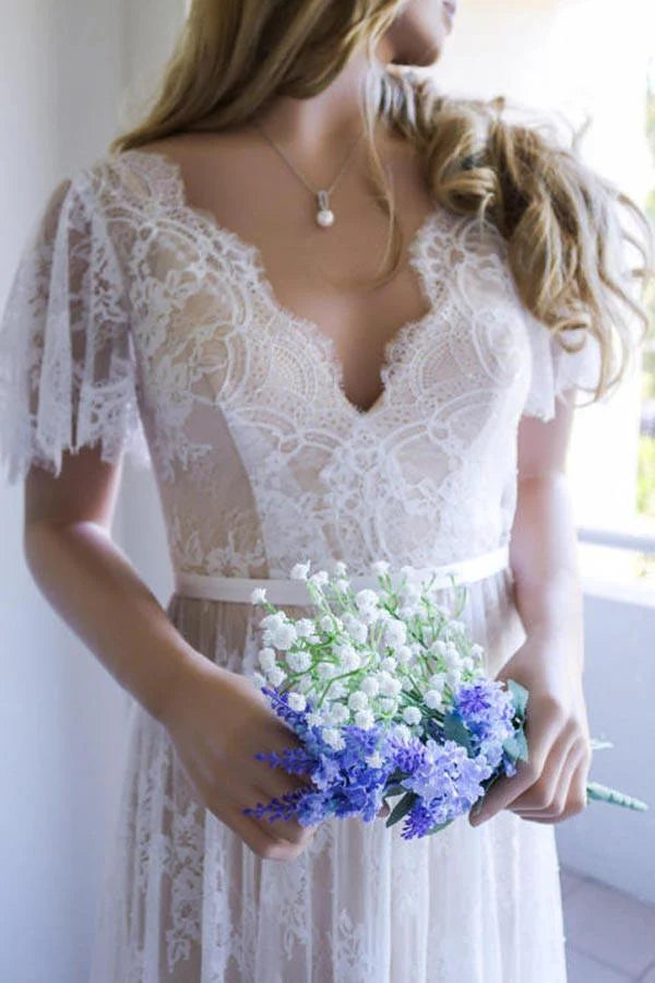 Back view of A-line lace wedding dress showing open back detail.