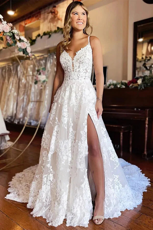 Elegant A-line tulle wedding dress with sweetheart neckline, spaghetti straps, and high slit.
