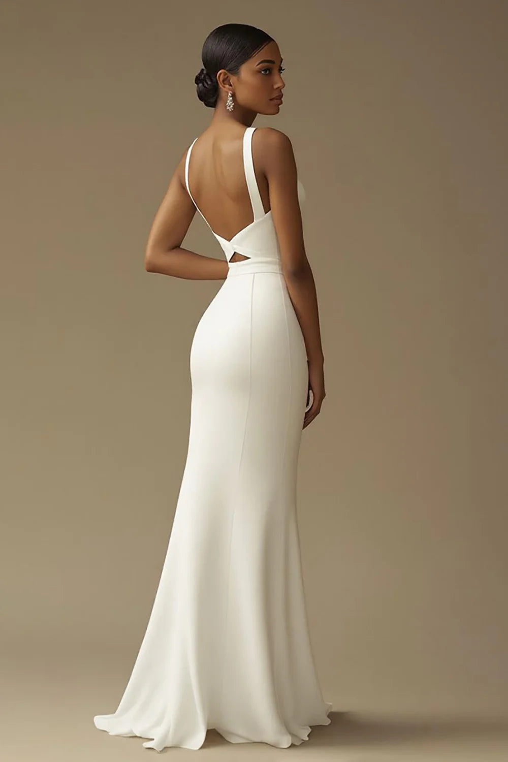 Side view of the white mermaid wedding dress, highlighting its elegant silhouette and daring slit.