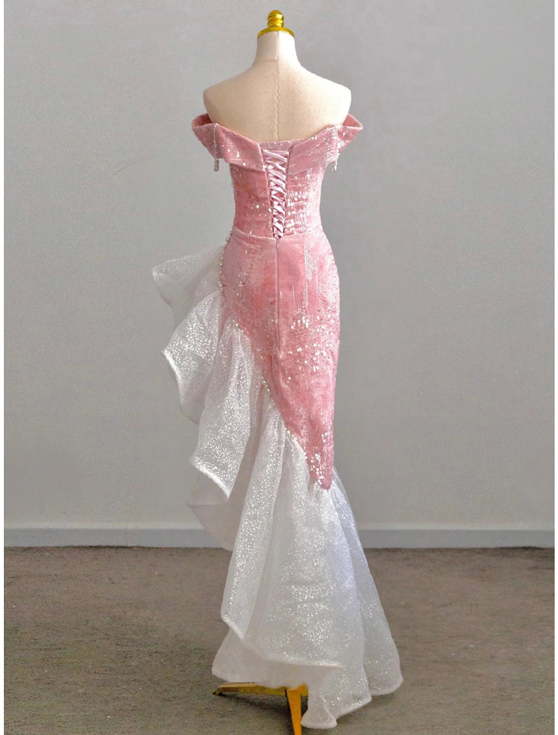 Close-up of sequin and pearl embellishments on BL Dress mermaid gown.