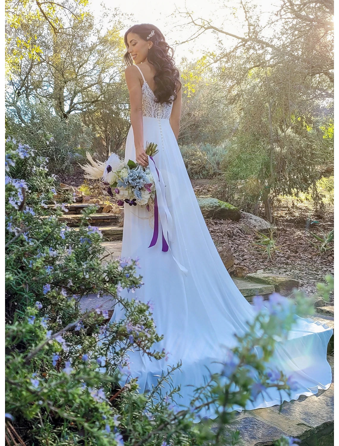 Boho A-line wedding dress with V-neck and spaghetti straps.