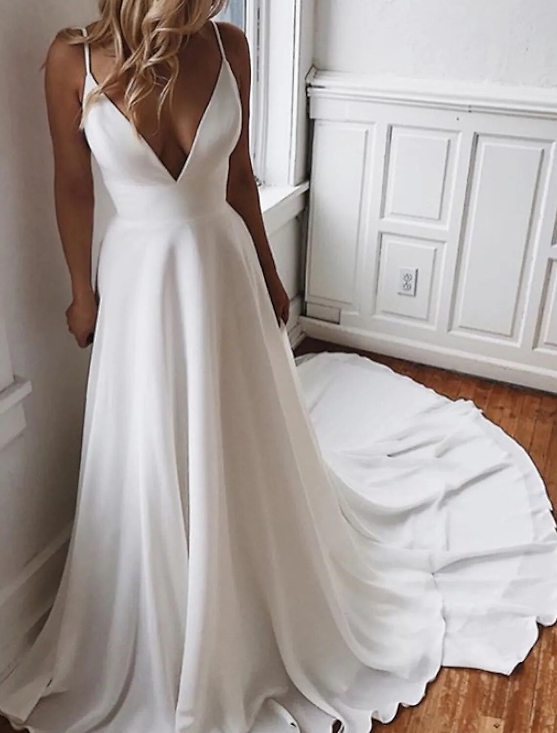 Side view of a bride wearing a chiffon boho wedding dress.
