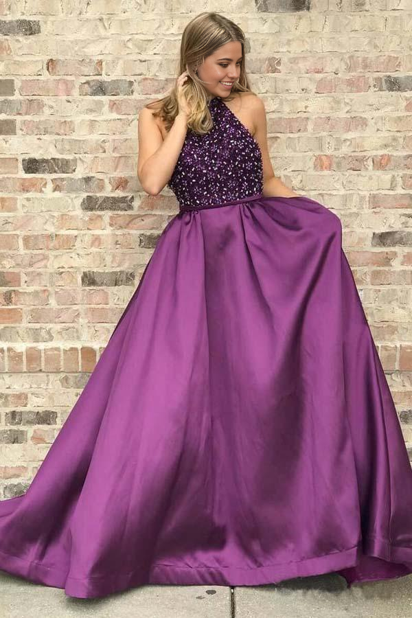 Elegant purple long prom dress with intricate beading and a high neckline, featuring an A-line silhouette.