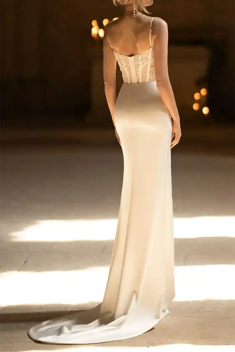 Back view of the beaded mermaid wedding gown, showcasing delicate straps and train.