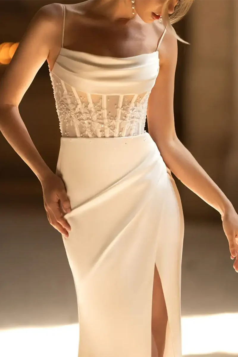 Front view of the mermaid bridal dress, highlighting the elegant silhouette and slit.