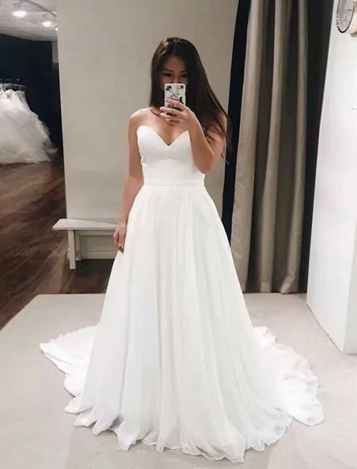 Elegant A-Line sweetheart strapless chiffon wedding gown with a court train.