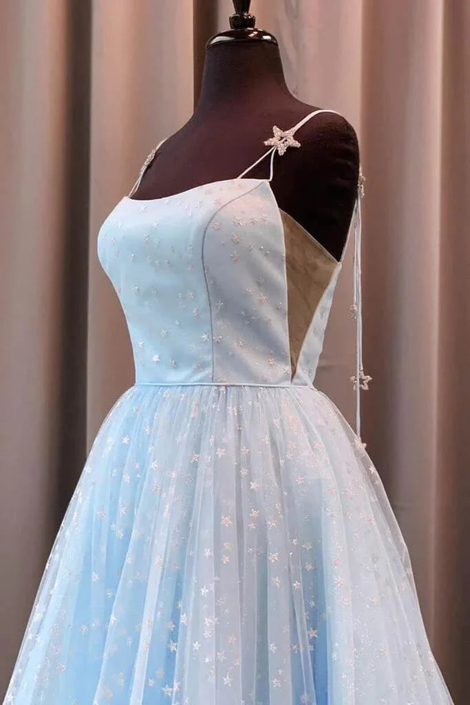 Full view of a beautiful light blue spaghetti strap A-line dress.