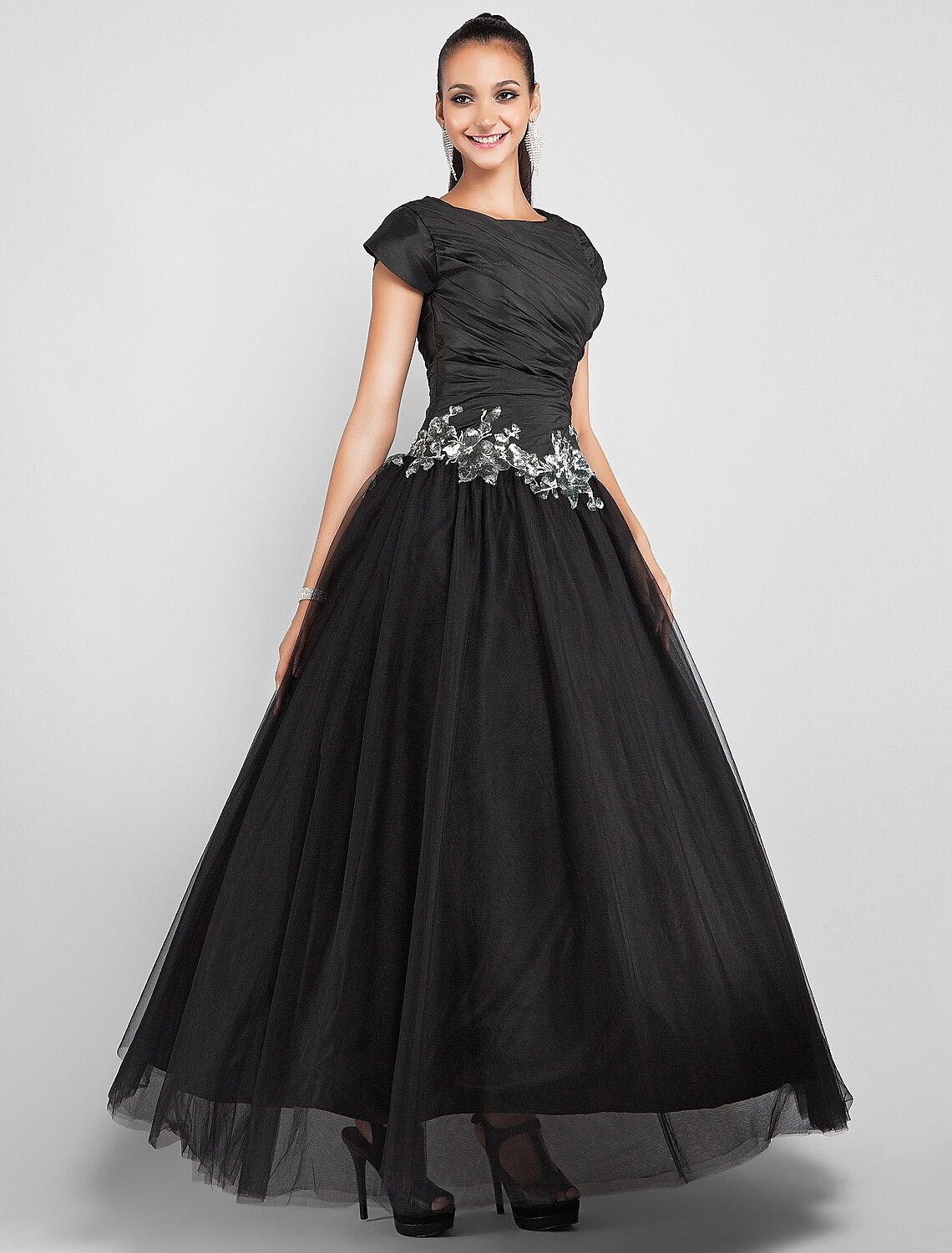 Another angle of the black taffeta ball gown, showing its elegant silhouette.