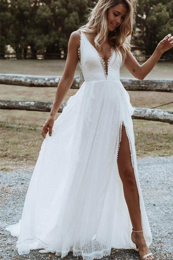 Bohemian A-Line V-Neck wedding dress with lace appliques and a high split.