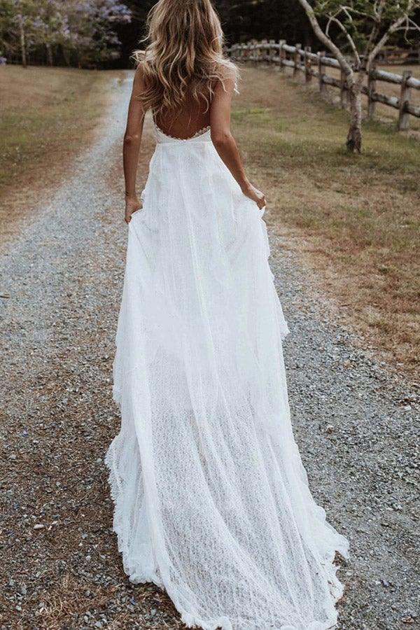 Close-up of lace appliques and V-neckline on the wedding dress.