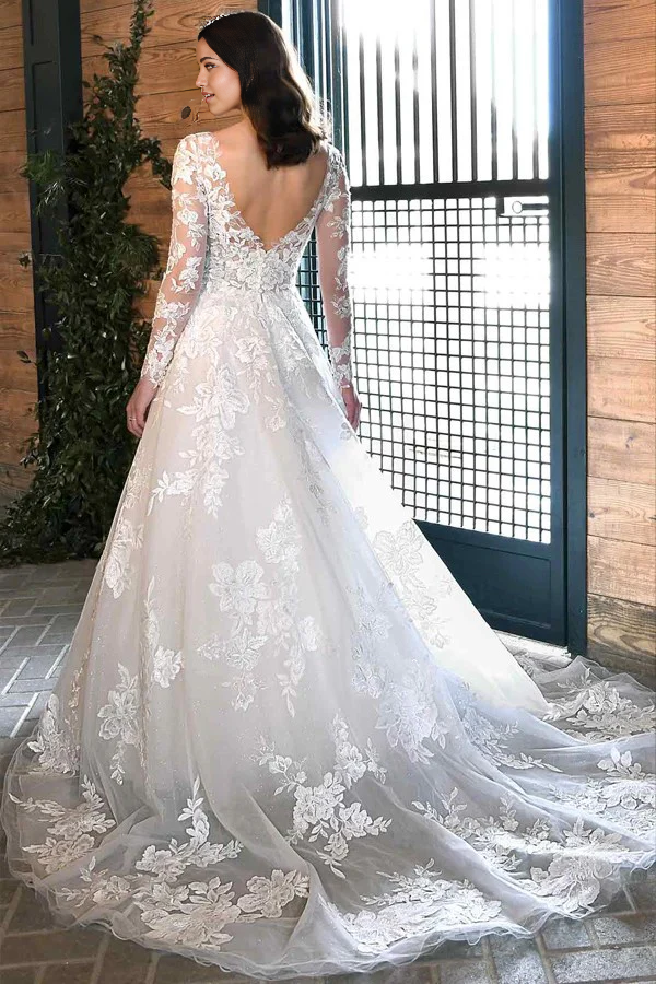Elegant V-neck long sleeve bridal dress in ivory lace, perfect for rustic weddings.