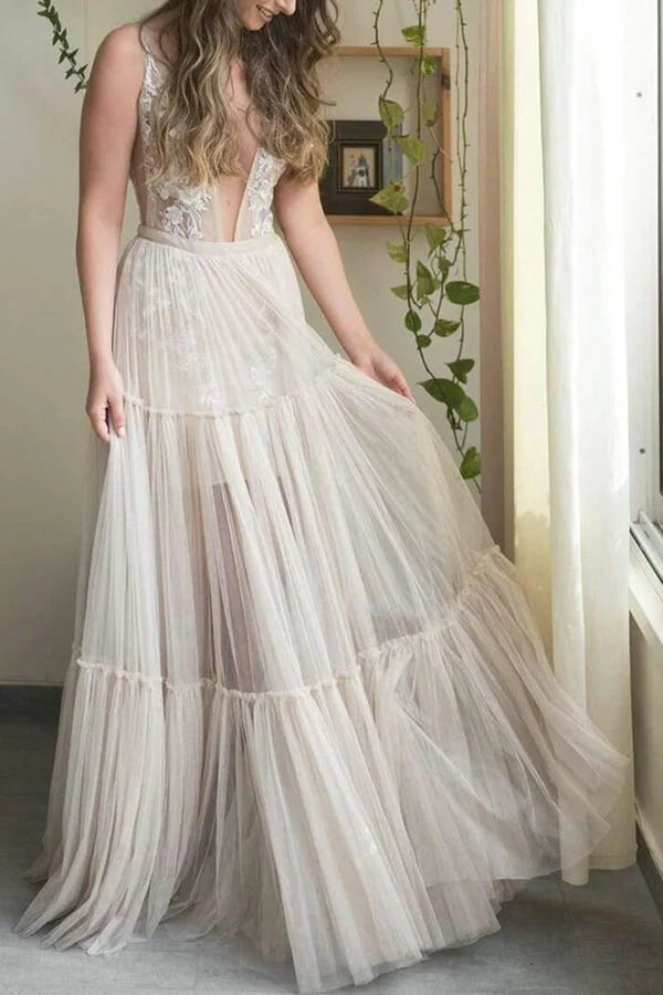 Elegant bridal gown featuring an A-line silhouette, V-neck, and intricate appliqued details.