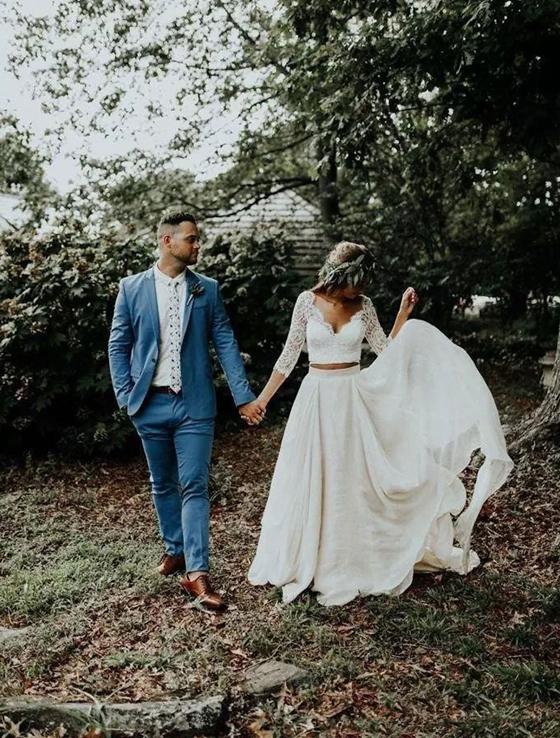 Close-up of V-neckline and 3/4 length sleeves on chiffon wedding dress.