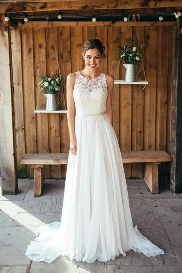 Bohemian lace V-neck ivory wedding dress with a long train.