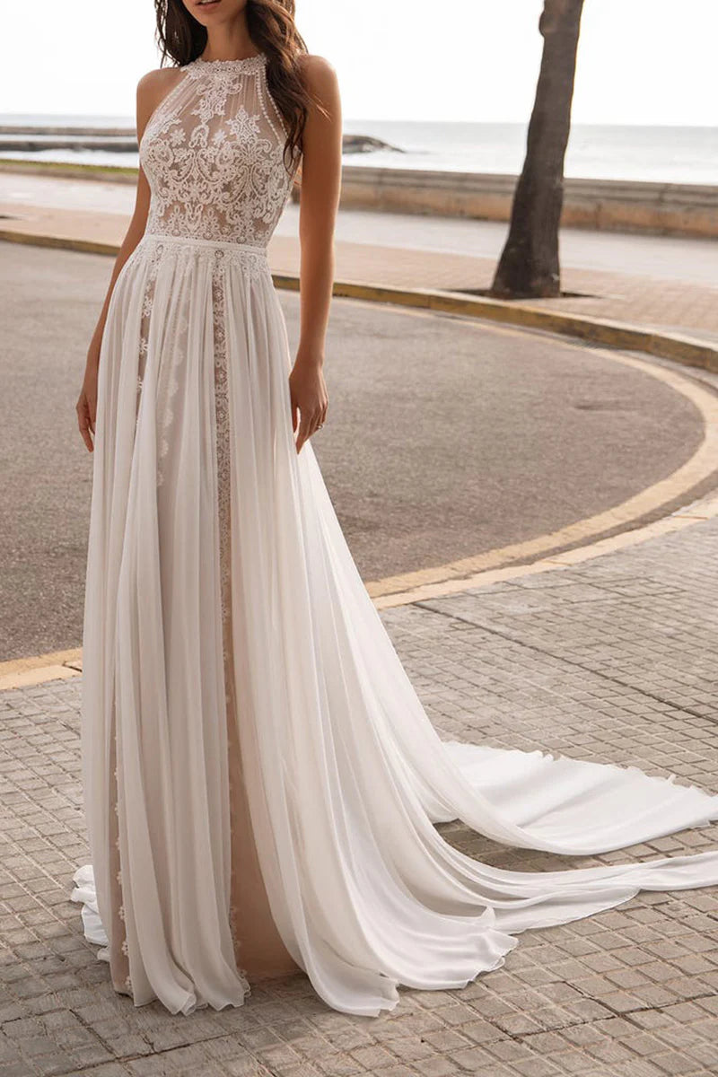 Full length view of a bride in a Boho A-line lace wedding dress with boat neck and spaghetti straps.
