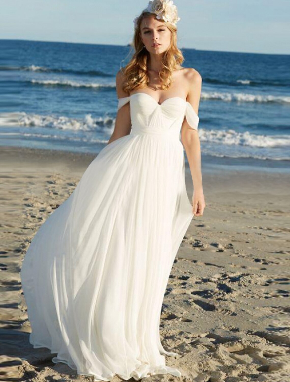 Boho A-line chiffon wedding dress with off-shoulder cap sleeves and pleats.