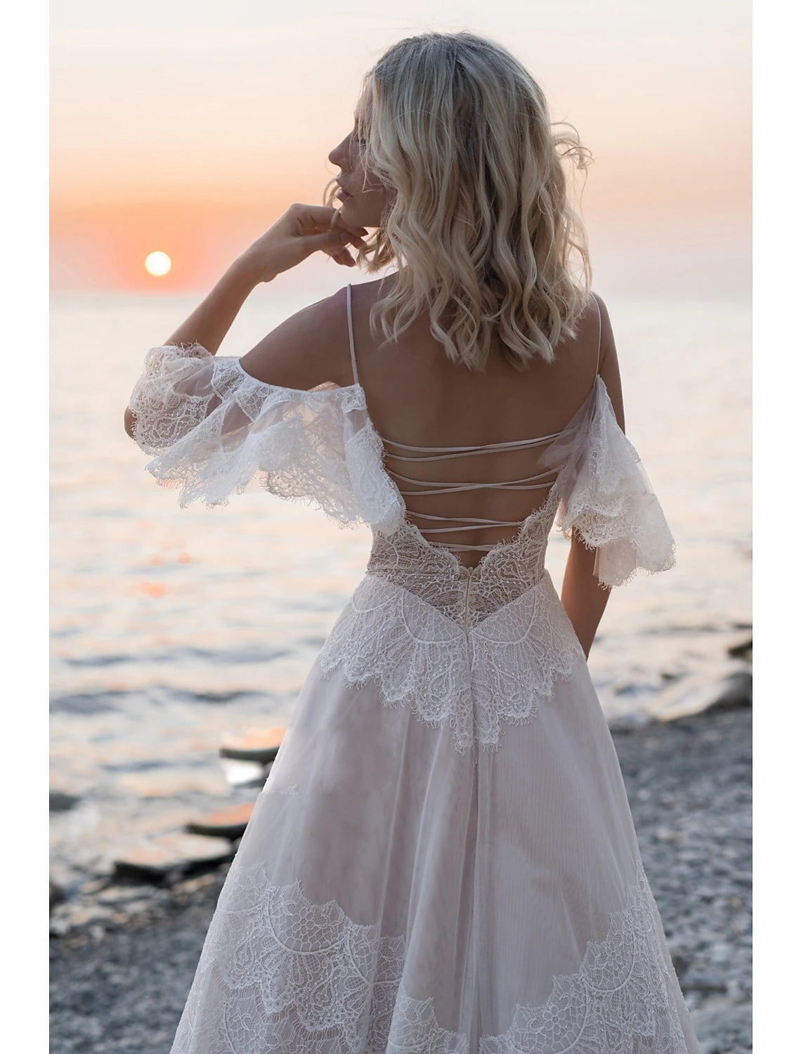 Back view of Boho A-Line Wedding Gown, highlighting open back and sweep train.